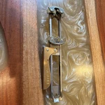 Alltoolie Stainless Steel Manual Can Opener Silver Gold Pat 2669142. Fixed Price $30.00.