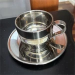 Oggi Stainless Steel Coffee Cup & Saucer Silver With Handle Two-piece Set. Fixed Price $22.49.