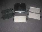 George Foreman Evolve System GBR5750SBLQ W/ Wafflegrill Accessories. Fixed Price $99.99.