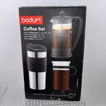 Bodum Coffee Set Brazil Press, Travel Mug, Bistro Glass And Spoon Nib. Fixed Price $47.44.