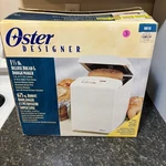 New In Box 1997 Oster 5814 Deluxe 1.5 Lbs. Bread And Dough Maker. Fixed Price $70.00.