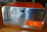 Rare 1960'S Orange & Chrome Front Large Bread Box Built-in Cutting Board. Fixed Price $125.00.