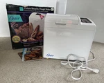 Oster Deluxe Bread & Dough Maker Model 4812 W/guide New Old Stock Open Box. Fixed Price $119.00.