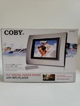 Coby 5.6" Digital Photo Frame With MP3 Player DP-557 ,( Open Box ) New. Fixed Price $35.00.