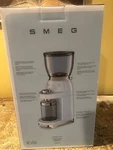 Brand New Smeg Pastel Green Conical Burr Coffee Grinder Model # CGF11PGUS. Fixed Price $325.00.