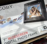 Coby DP-557 Digital Picture Frame 5.6 Inch Screen Open Box Never Used. Fixed Price $20.00.